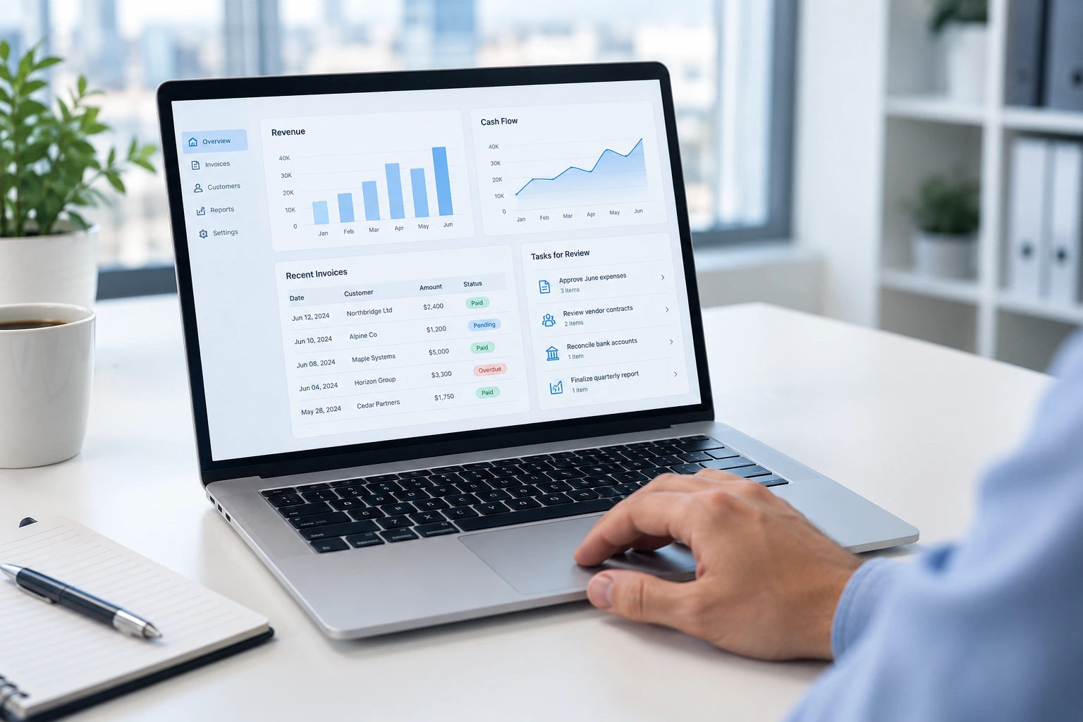 Illustrative finance software on a laptop in a bright modern office